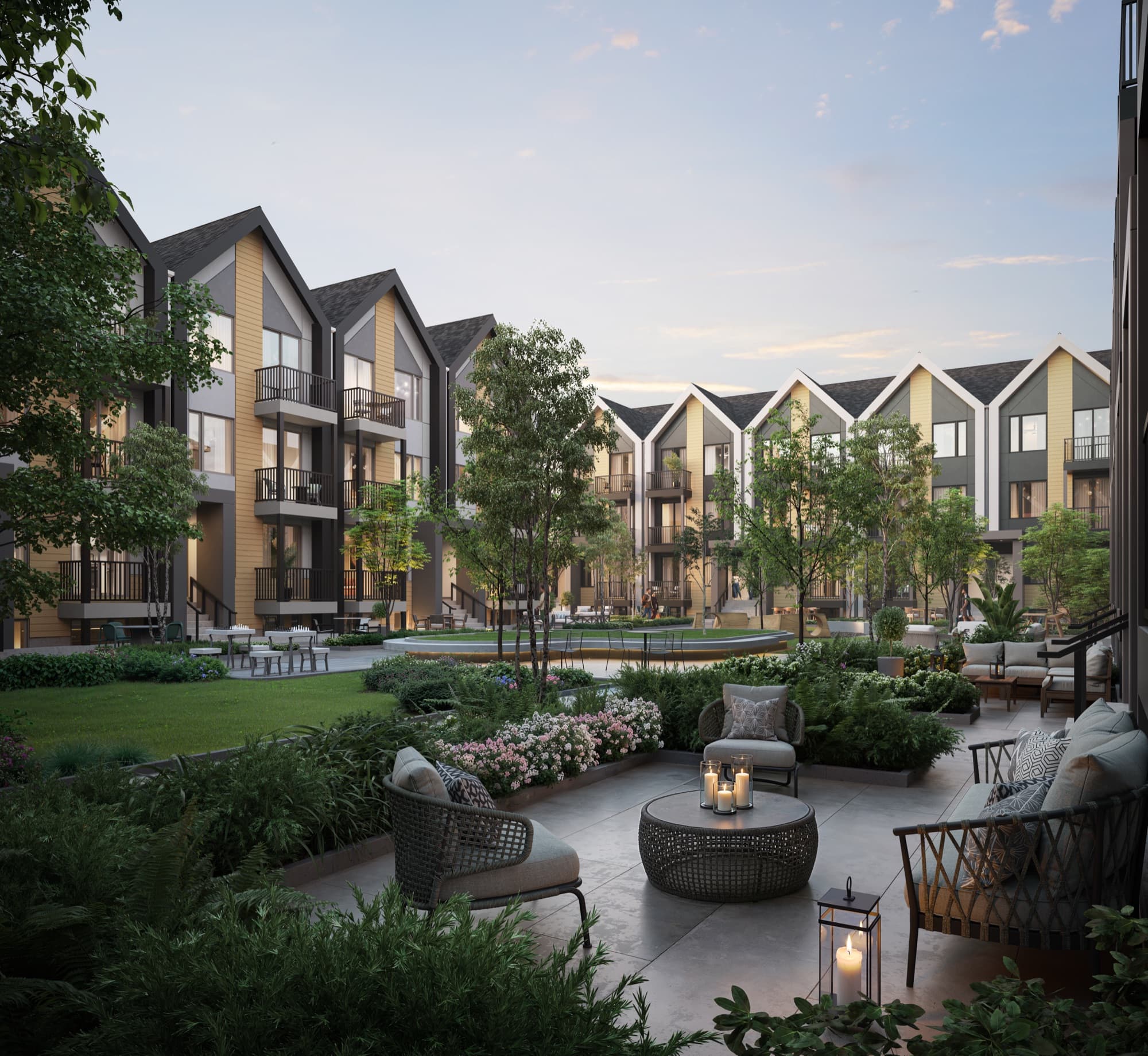 Landscaped interior courtyard at Aura at dusk with seating and mature planting